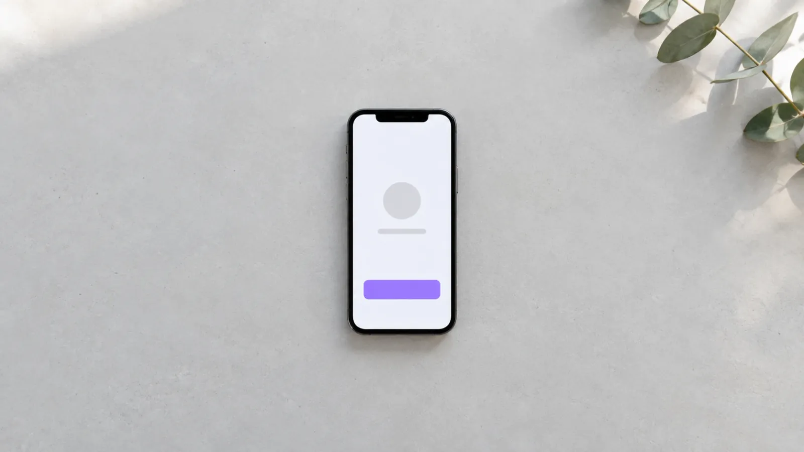 Mobil med et svært enkelt appdesign på en lys, tom flate